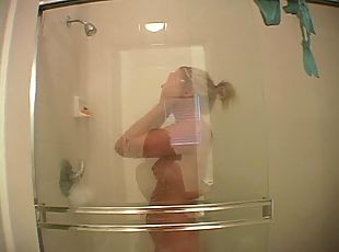 Leg shaving naked blonde in the shower